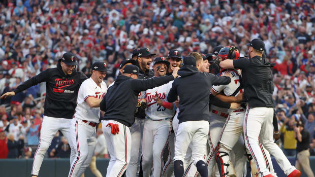 Oct 4, 2023; Minneapolis, Minnesota, USA; The Minnesota Twins storm the field after defeating the Toronto Blue Jays during game two of the Wildcard series for the 2023 MLB playoffs at Target Field. Credit: Jesse Johnson-USA TODAY Sports